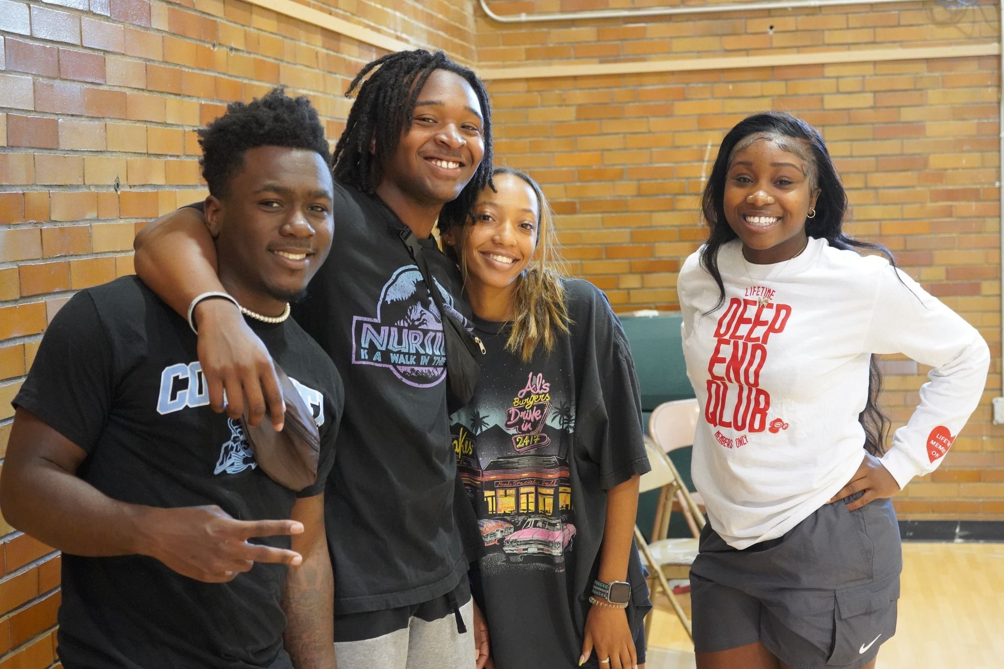 teens huddled together and smiling